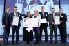 Foto: Laudatoren und Preisträger  auf der Bühne: Wolfgang Anzengruber (VERBUND), Franz M. Androsch (voestalpine), Sabine Hild (JKU), Ministerin Margarete Schramböck, Markus Borz und Ronald Fluch (voestalpine) und Gernot M. Wallner (JKU).